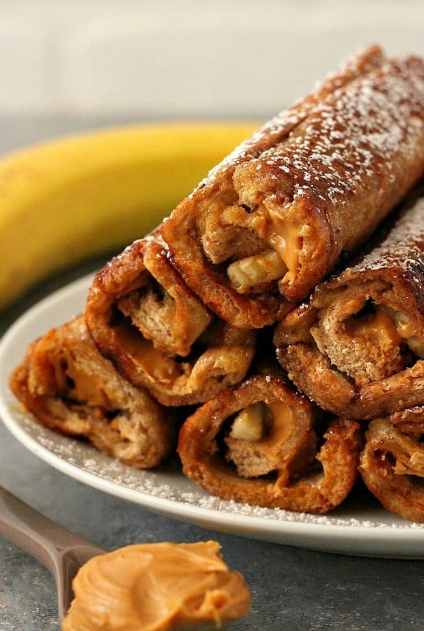 Peanut Butter Banana Roll Ups on a plate.