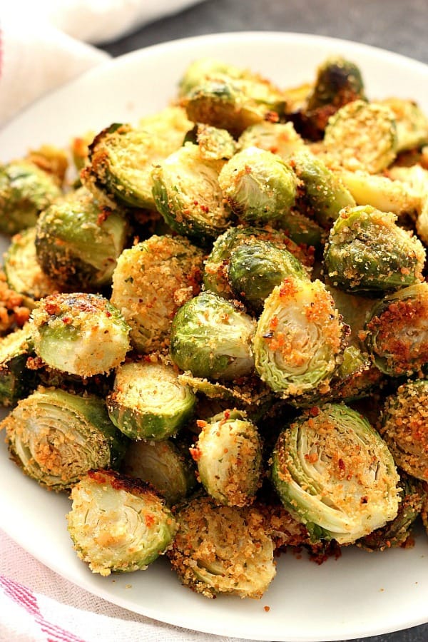 Roasted Brussels sprouts on a white plate.