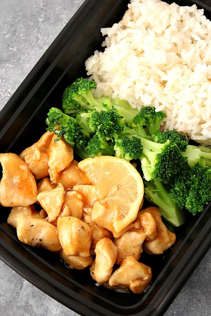 Overhead shot of meal prep container with lemon chicken, broccoli and rice. 