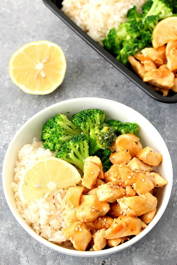 Honey Lemon Chicken Rice Bowls Recipe - quick and easy dinner idea that's better than takeout! This sweet and tangy chicken makes for a perfect meal prep. Honey Lemon Chicken in a bowl.