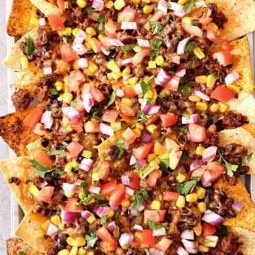 Nachos on a baking pan.