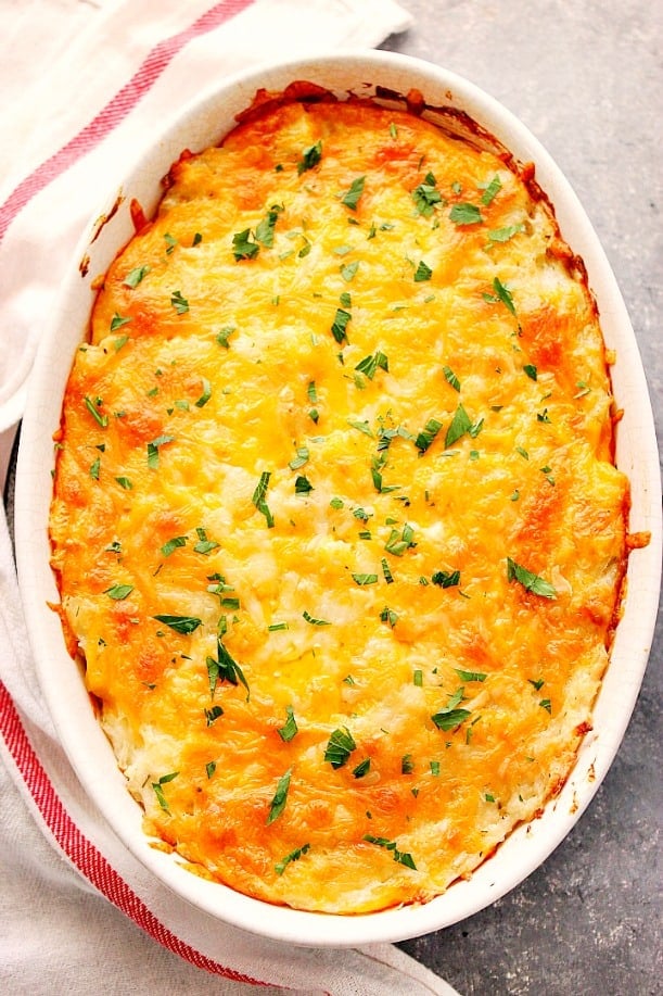 Hashbrown Casserole in white oval baking dish.