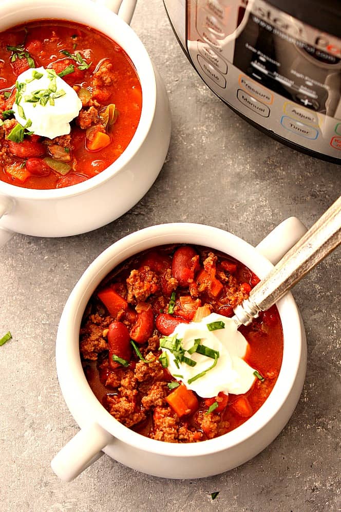 Instant Pot Beef Chili Recipe - rich and flavorful beef and bean chili that's made in pressure cooker! Tastes as if it was cooking all day but takes only 20 minutes to make!