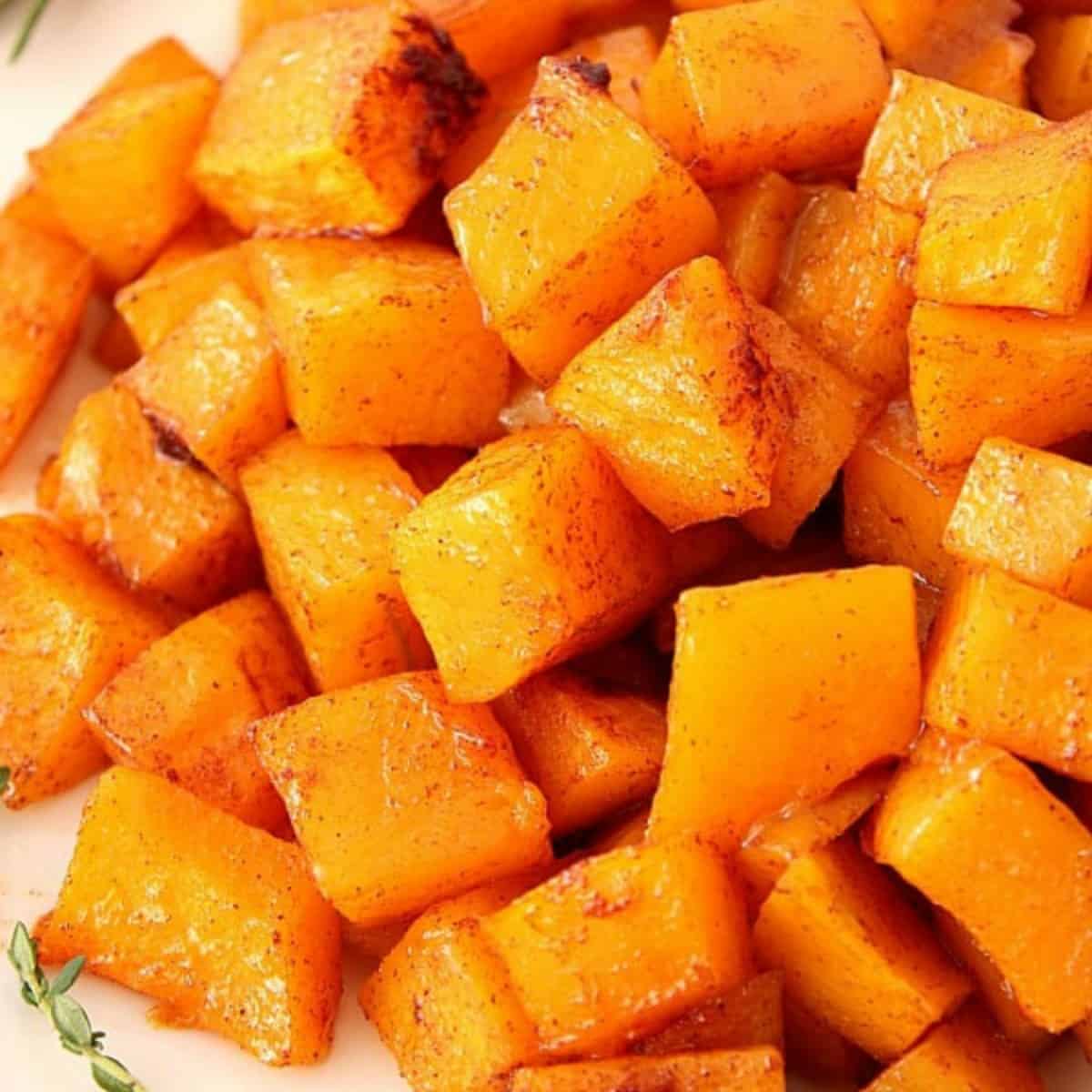 Cubes or roasted squash on a plate.