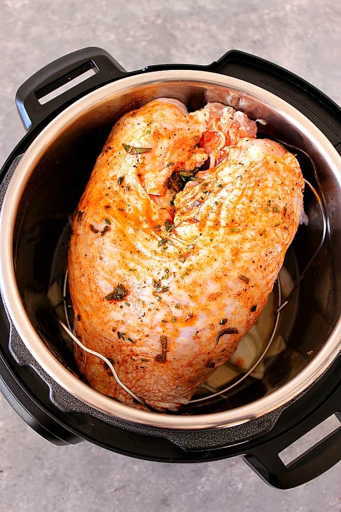 Overhead shot of turkey breast, season, inside of the Instant Pot pressure cooker.