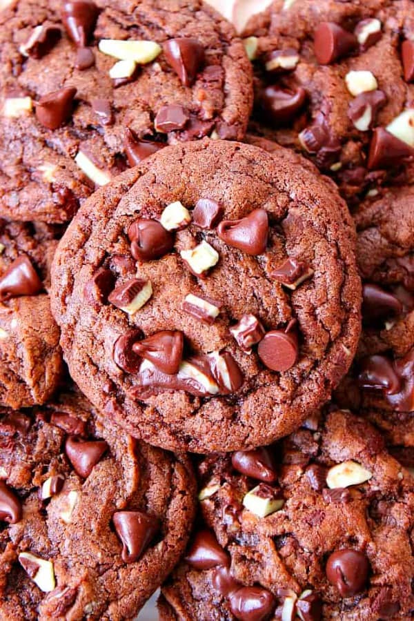Mint Chocolate Chip Cookies Recipe - chocolate cookies filled with mint chips and chocolate chips. Mint Chocolate Chip Cookies stacked on each other.