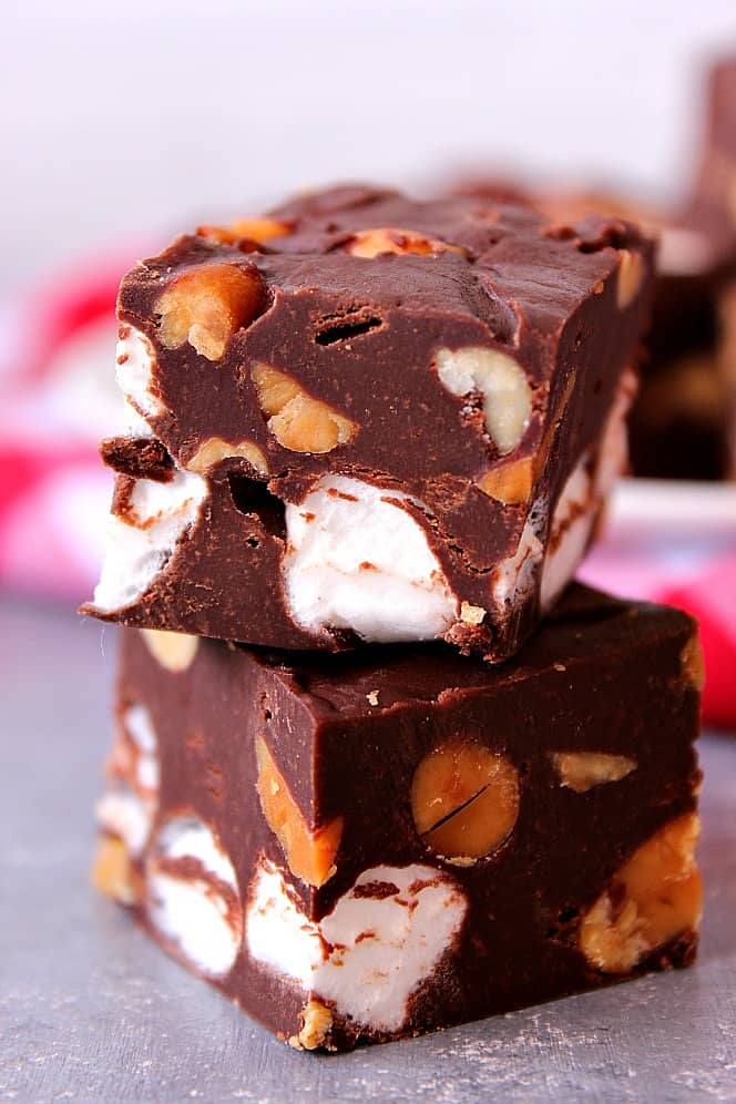 Rocky Road Fudge made with just 4 ingredients. Rocky Road Fudge squares on a board.