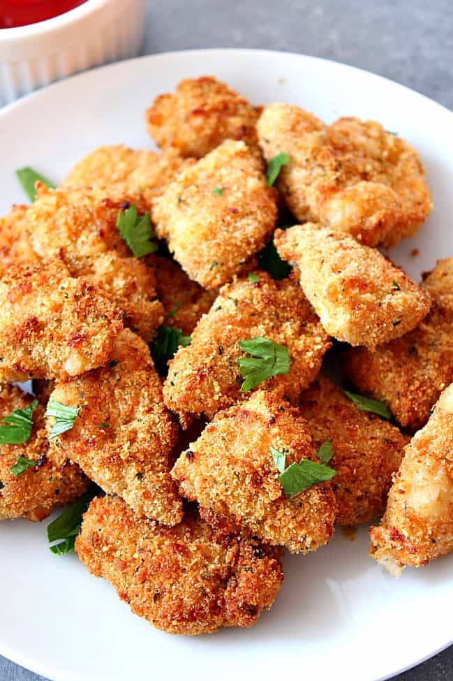 Air Fryer Chicken Nuggets Recipe - healthier option for a kid-friendly dinner! Easy homemade chicken nuggets, breaded and baked in an air fryer.