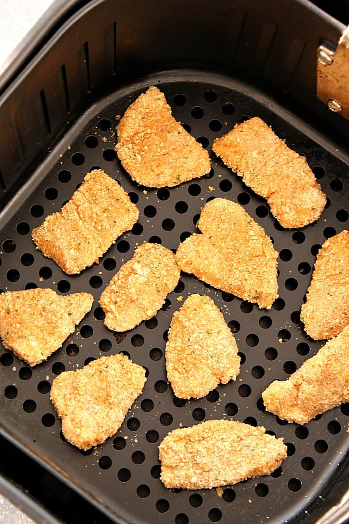 Air Fryer Chicken Nuggets Recipe - healthier option for a kid-friendly dinner! Easy homemade chicken nuggets, breaded and baked in an air fryer.