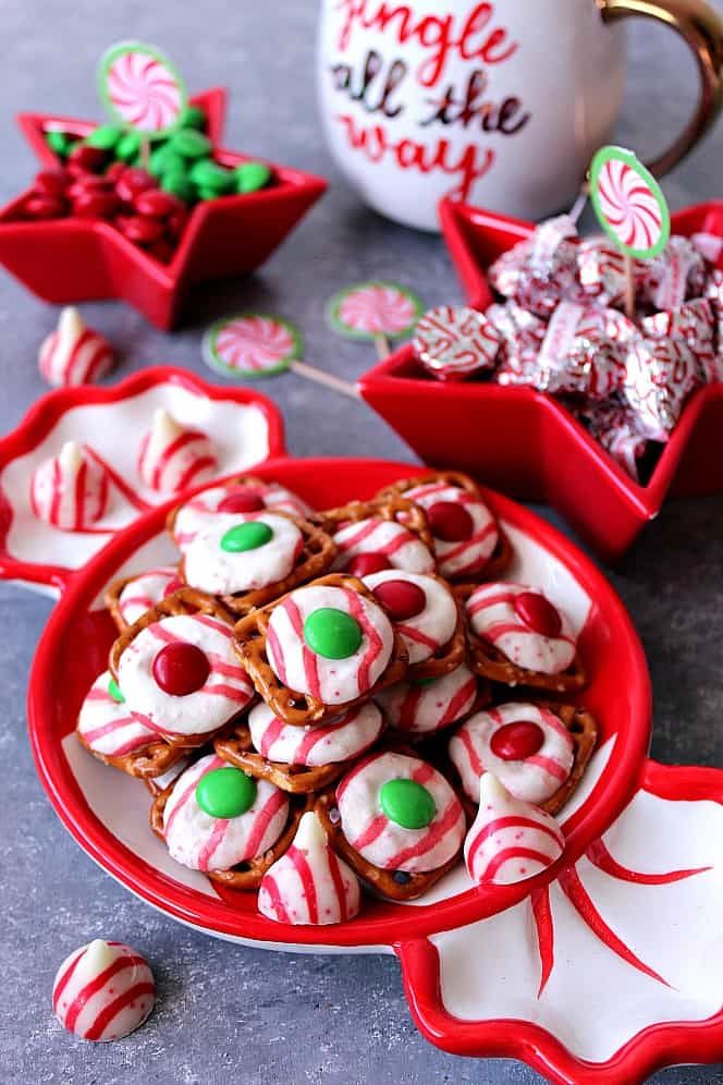 Peppermint Pretzel Candy recipe - crunchy pretzels topped with peppermint Kisses candy and M&M's makes for a festive holiday treat that is fun to make and eat!