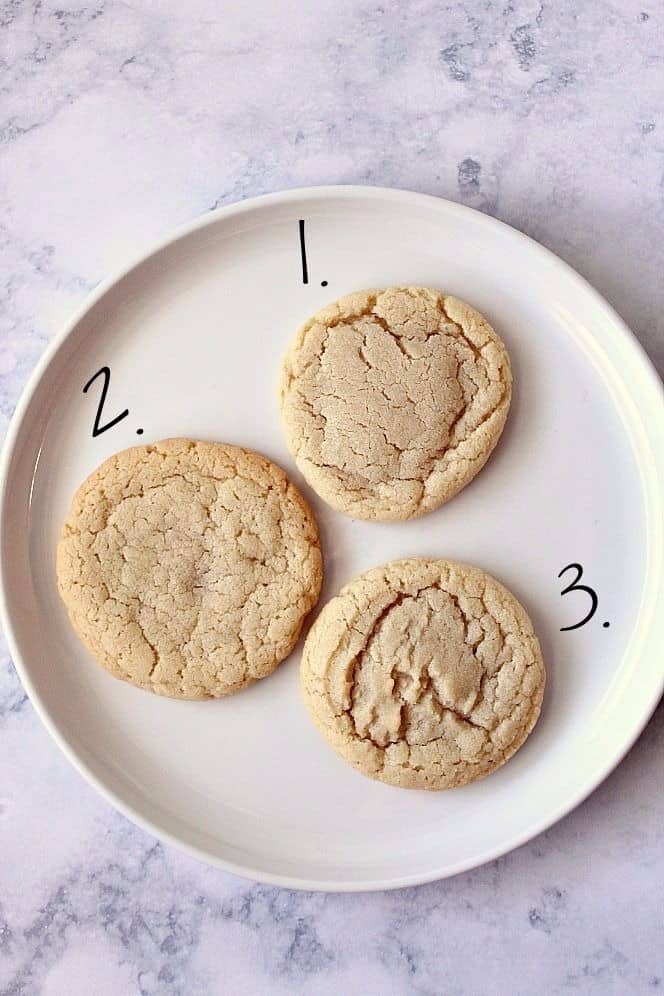 Thee types of sugar cookies on a plate.