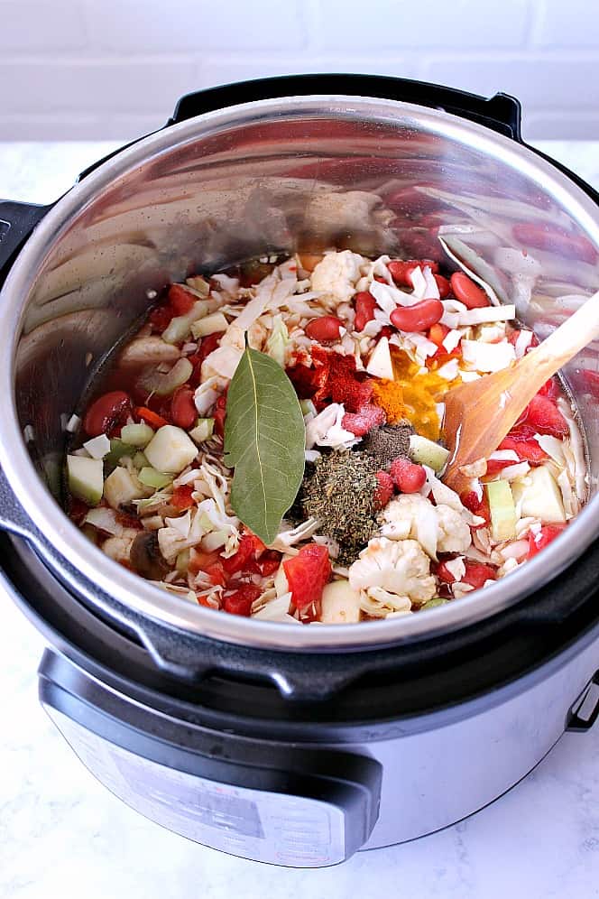 Instant Pot with all of the ingredients for vegetable weight loss soup. 