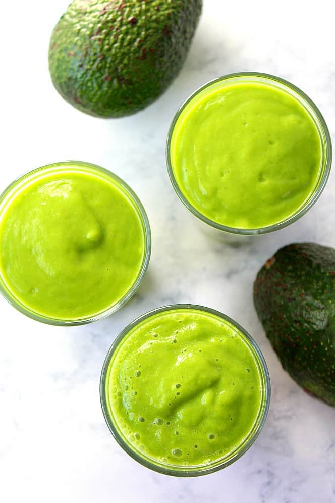 Avocado Glow Smoothie Recipe - creamy and thick smoothie packed with vitamins, fiber and antioxidants. Perfect healthy option for breakfast or snack! avocados and smoothie in glasses