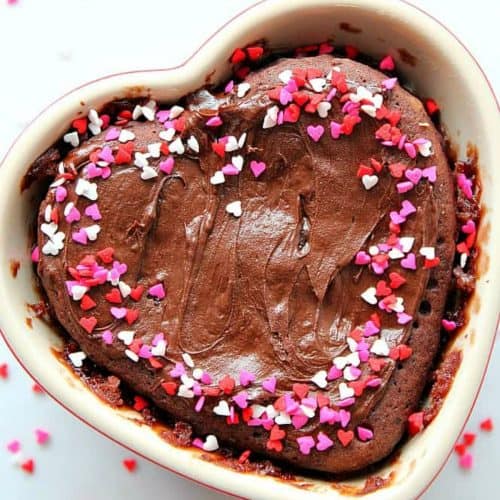 Chocolate cake in a heart shaped ramekin.
