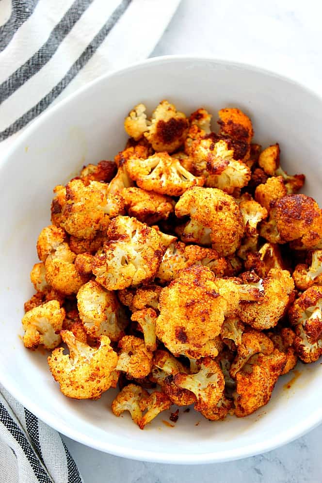Shawarma Roasted Cauliflower Recipe - delicious cauliflower tossed in shawarma seasoning and roasted to perfection. shawarma cauliflower in bowl