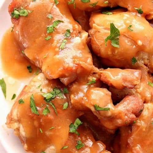 Instant Pot Sweet Garlic Chicken with sauce on white plate.