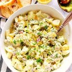 Overhead shot of egg salad in white bowl.