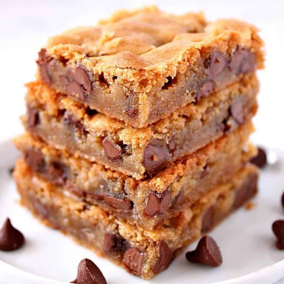 Blondie bars stacked on a plate.