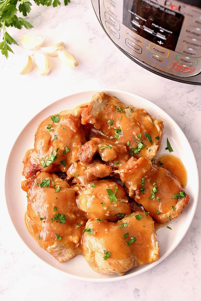 Instant Pot Sweet Garlic Chicken on white plate.