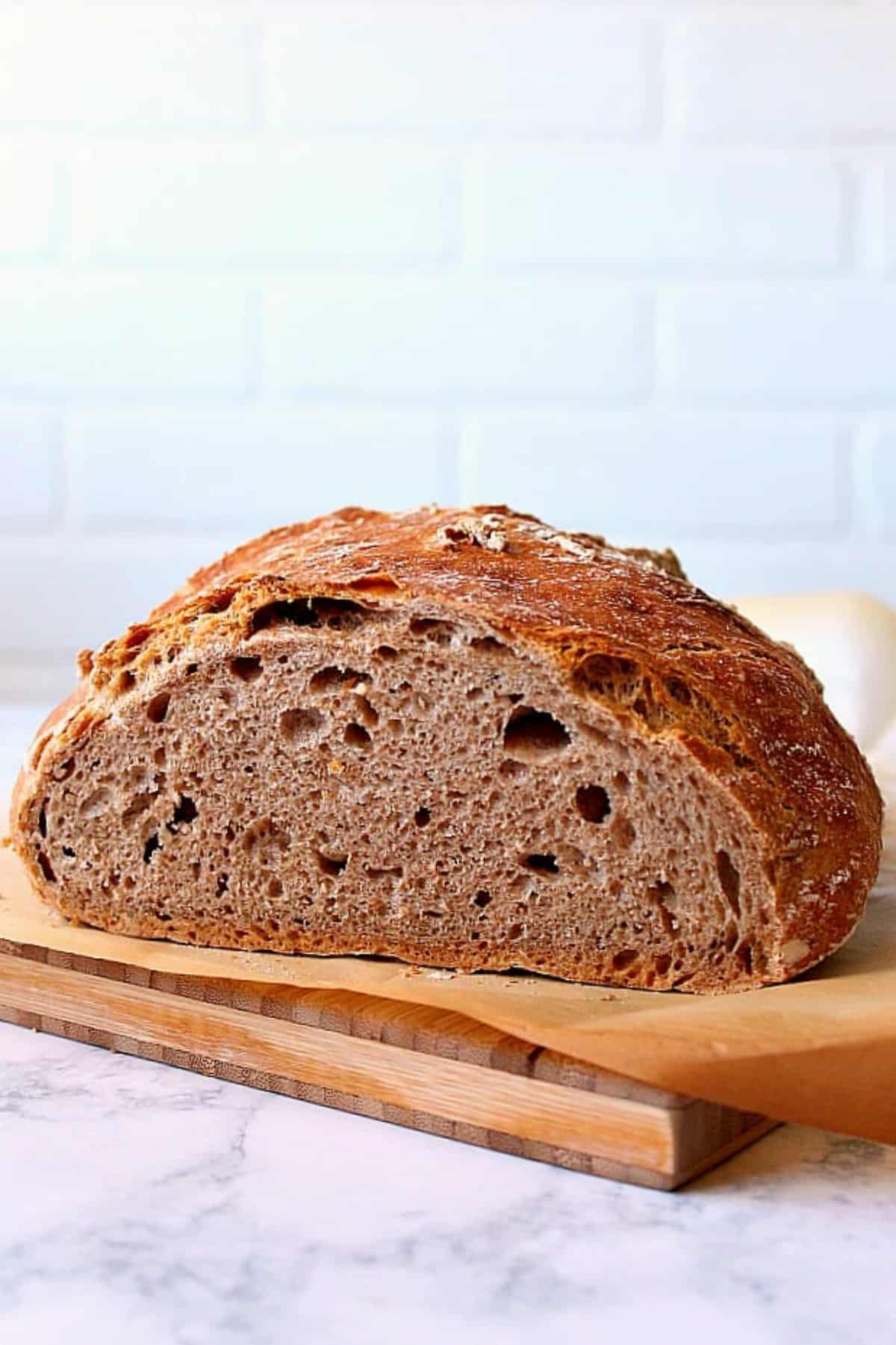 Whole wheat bread on a cutting board.