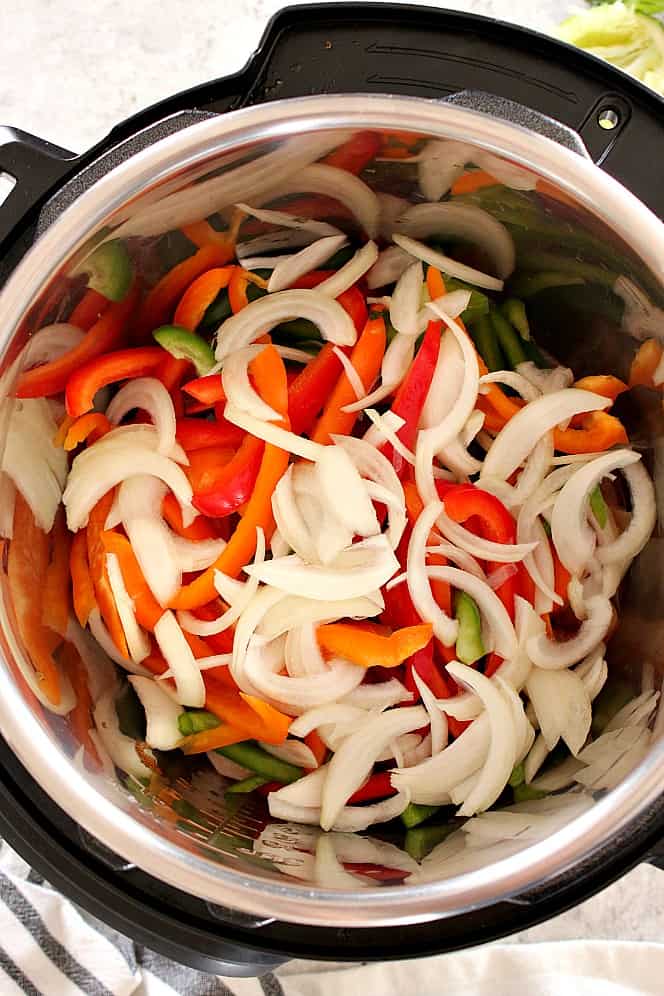 sliced peppers and onion in Instant Pot