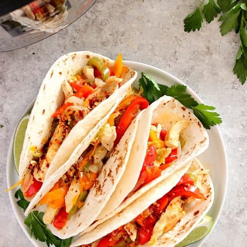 Instant Pot Chicken Fajitas on white plate.