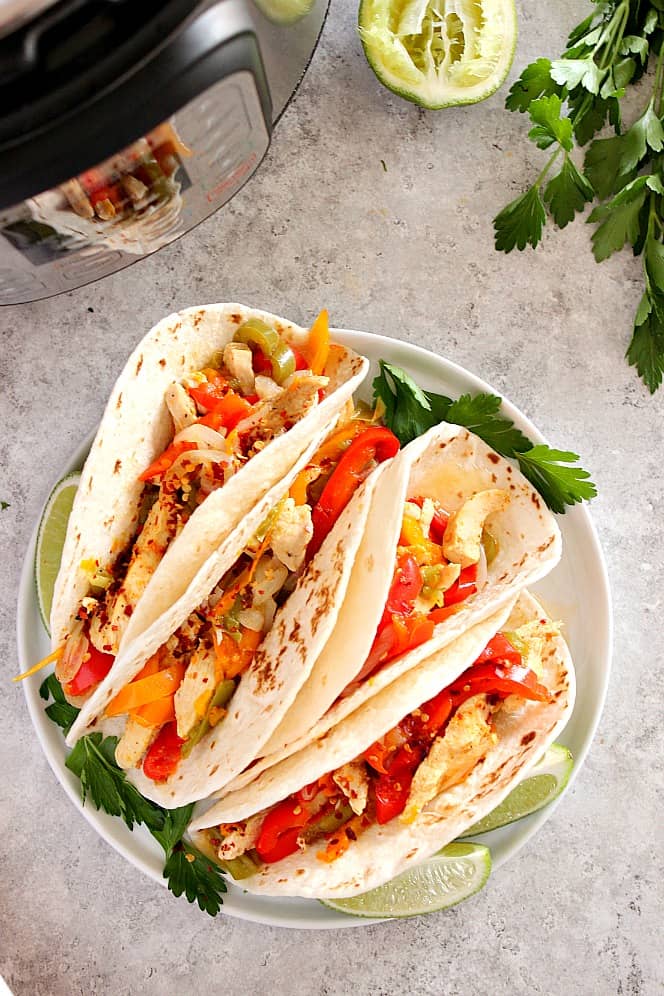 Instant Pot Chicken Fajitas on white plate.