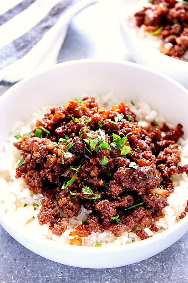 Korean Beef with rice in a white bowl.