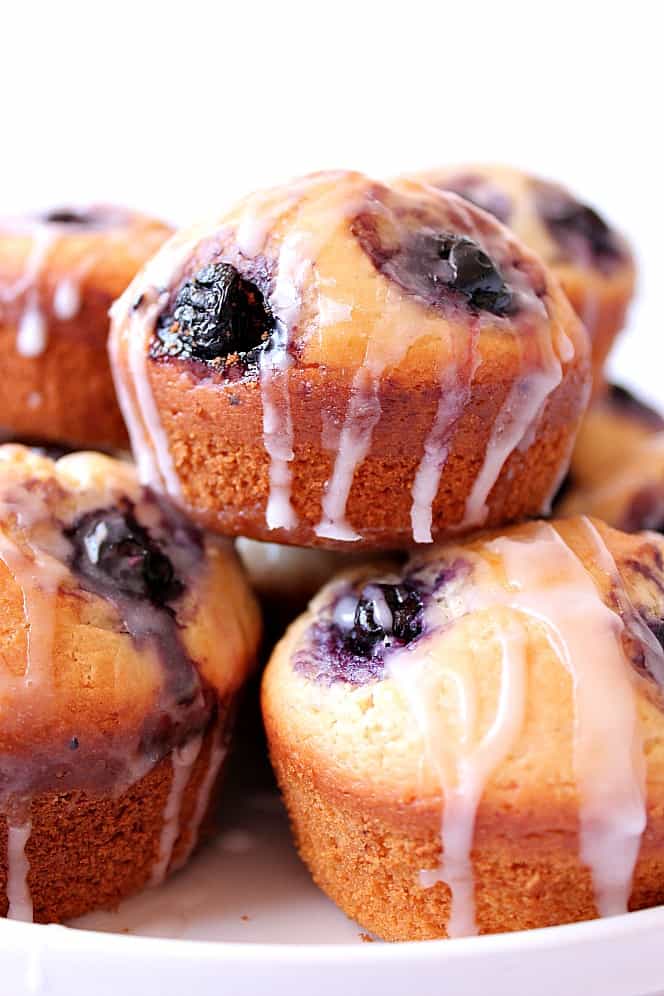 Stack of blueberry muffins with glaze.