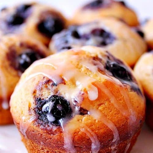 Blueberry Muffins on a white plate.