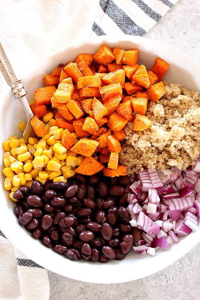 sweet potatoes, corn, black beans, red onion and quinoa in a bowl