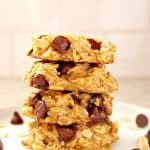 Oatmeal cookies stacked on a plate.