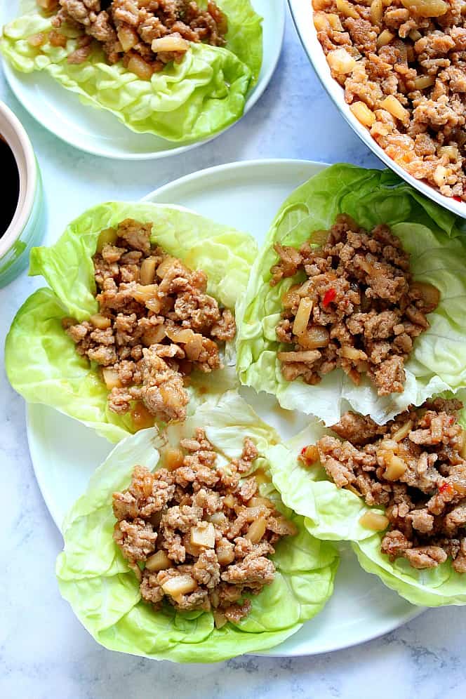 Overhead shot of Chicken Lettuce Wraps on plates.