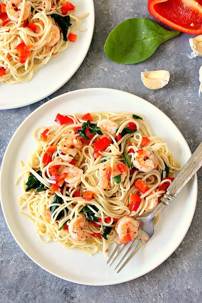 Overhead shot of Shrimp Scampi with red bell pepper and spinach. 