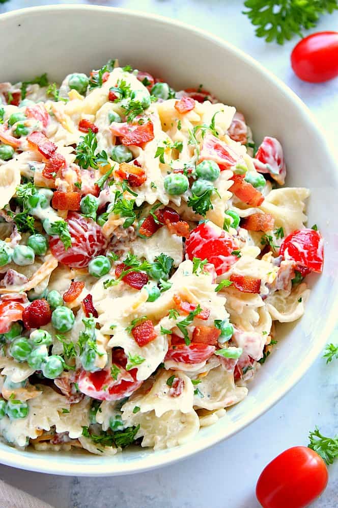 Overhead shot of pasta salad in white bowl. 