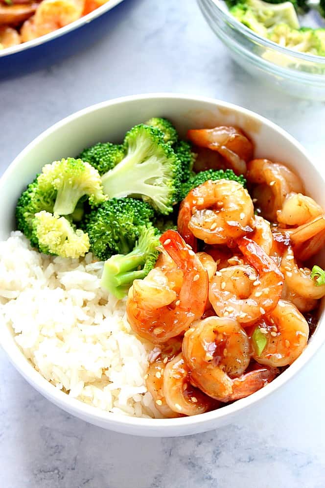 Shrimp with rice in a white bowl.