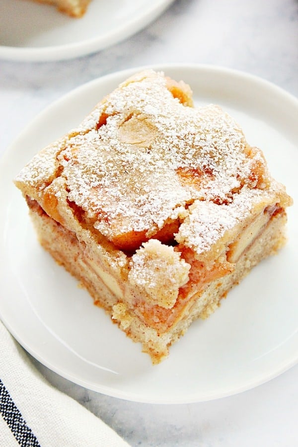 A piece of apple cake on plate.