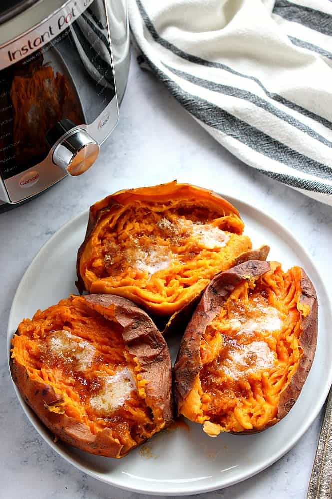 Overhead shot of baked sweet potatoes next to Instant Pot.