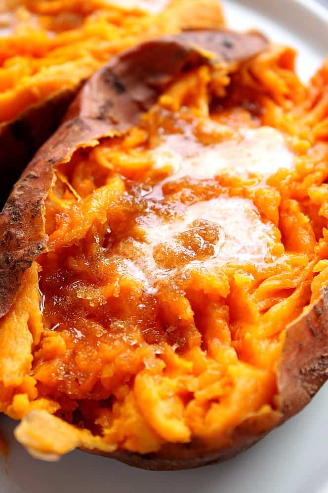 Close up on Instant Pot Sweet Potato with melted butter and brown sugar. 