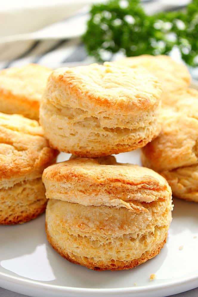 Perfect Buttermilk Biscuits placed on white serving plate.