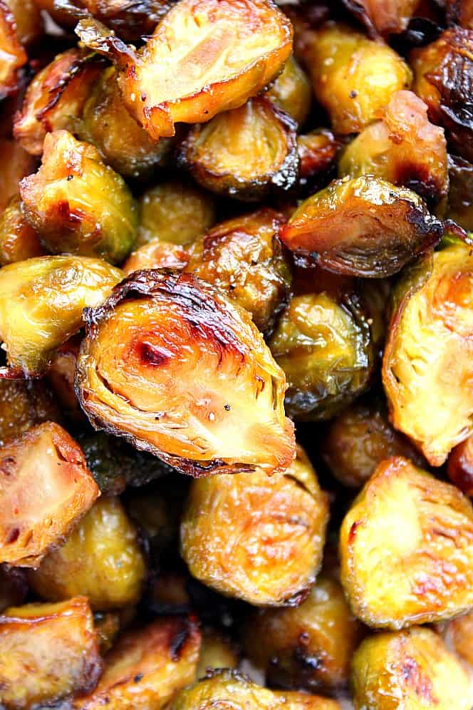 Overhead close up shot of roasted Brussels sprouts coated in honey balsamic dressing.