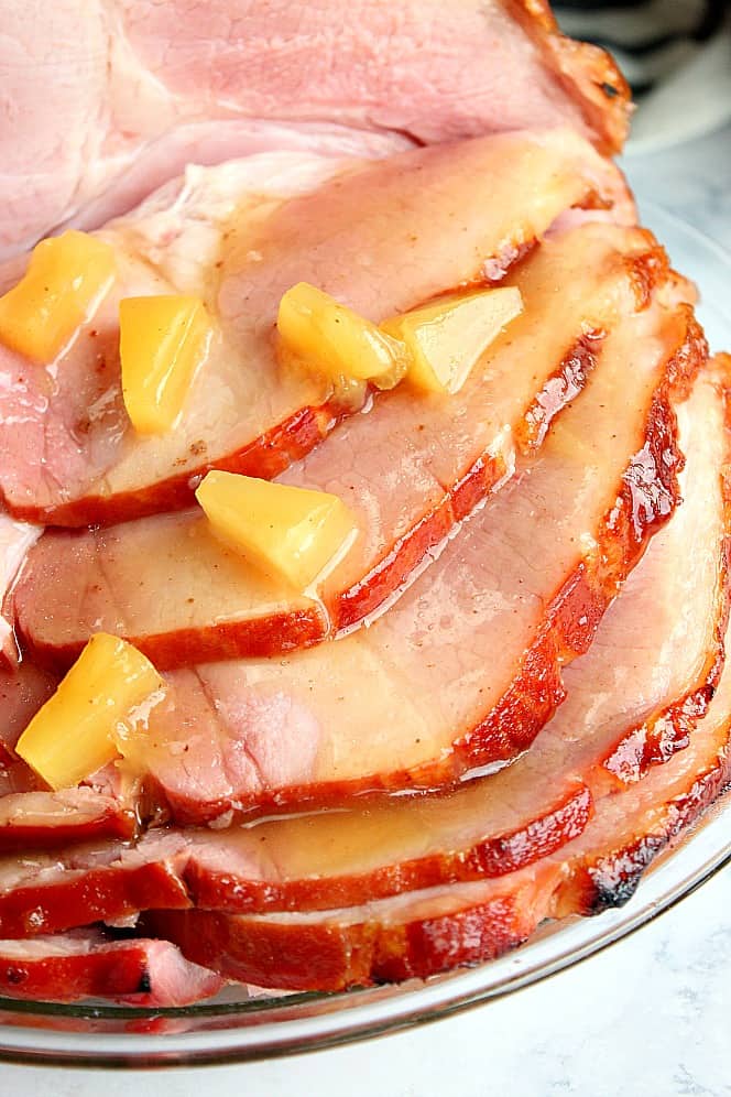 Close up shot of sliced ham with pineapple glaze. 