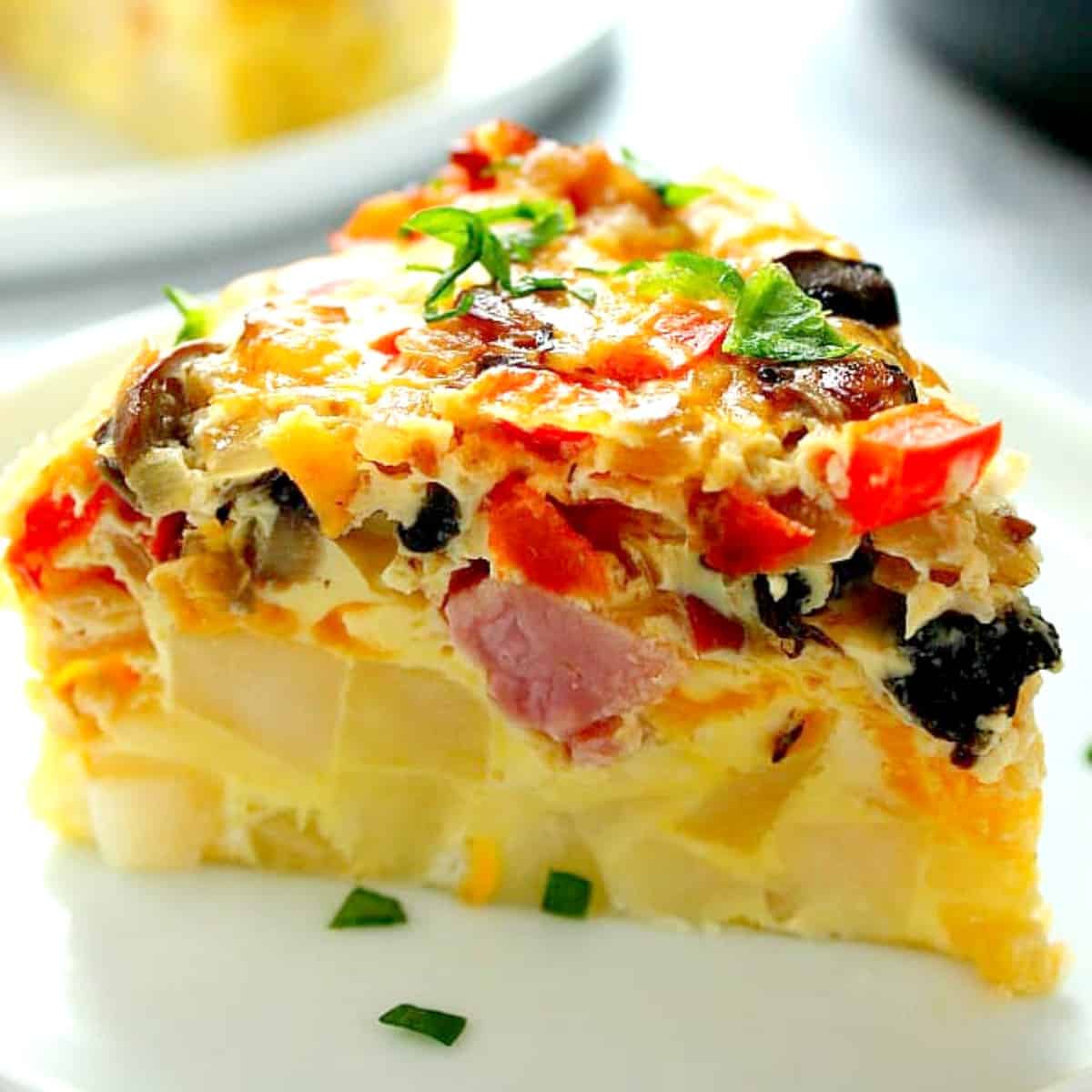 Slice of breakfast casserole on plate.