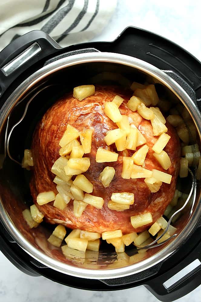 Overhead shot of ham with pineapple chunks in the Instant Pot. 