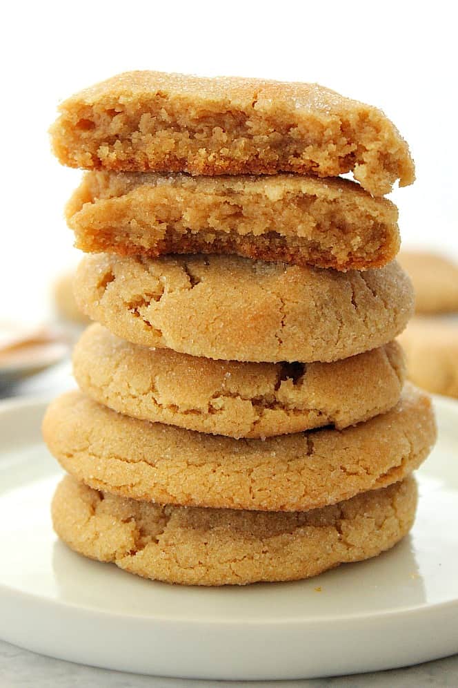 Side close up shot of peanut butter cookies stacked up on each other. 