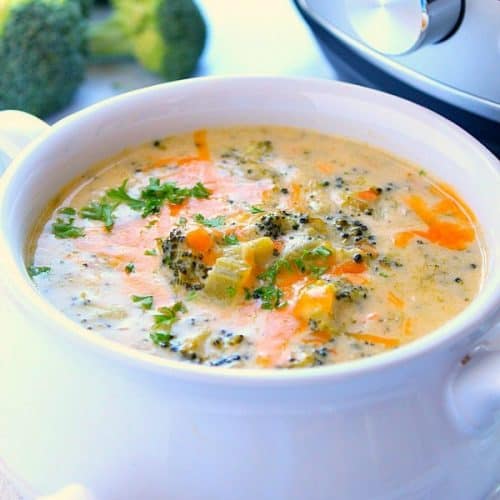 Instant Pot broccoli cheddar soup in white bowl with handles.