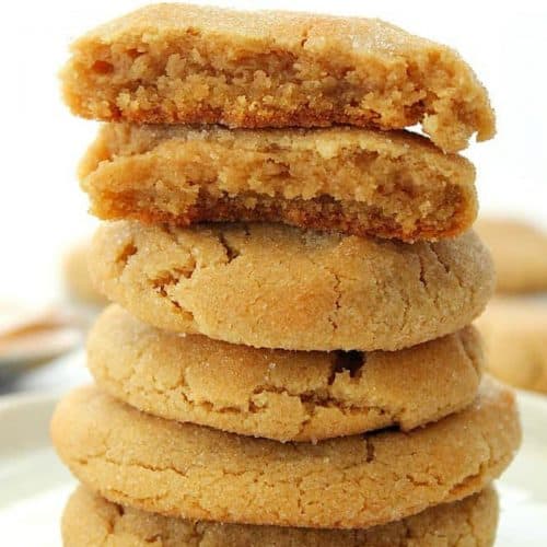 Stack of peanut butter cookies on a plate.