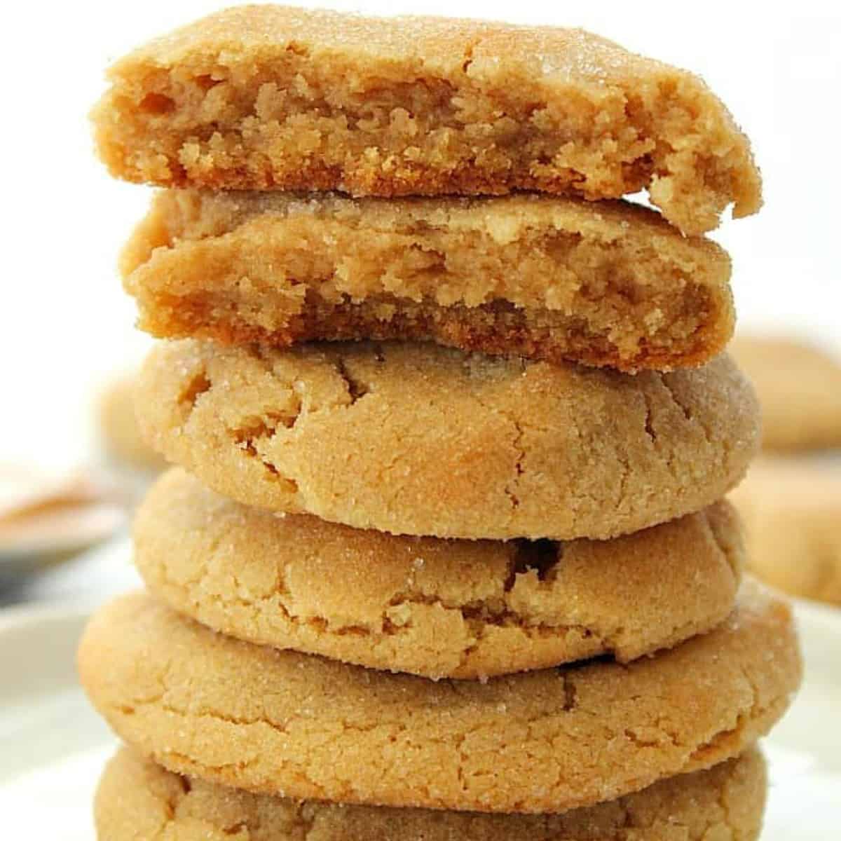 Stack of peanut butter cookies on a plate.