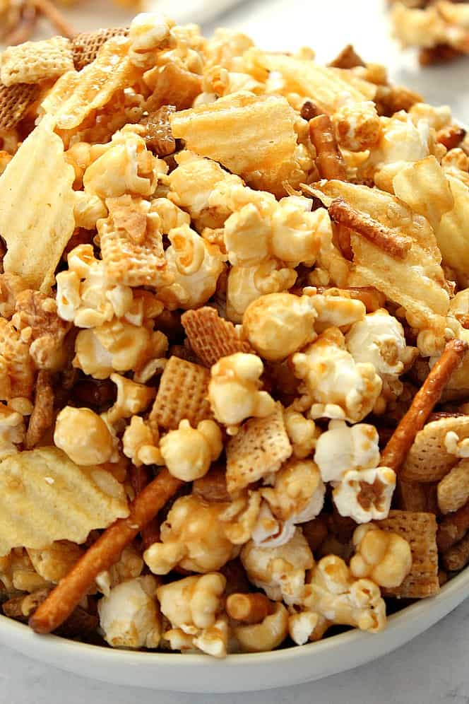 Side close up shot of party mix with caramel.