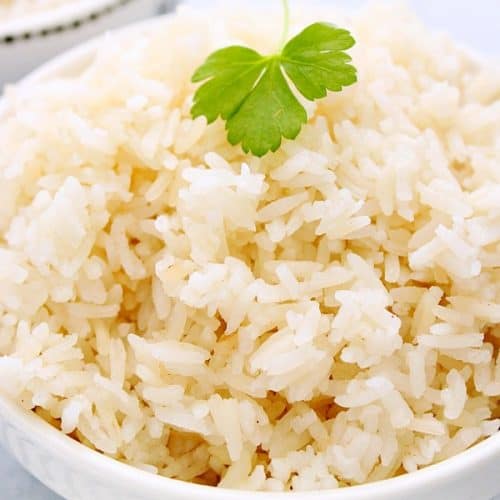 Cooked Instant Pot Fluffy Rice in a white bowl.